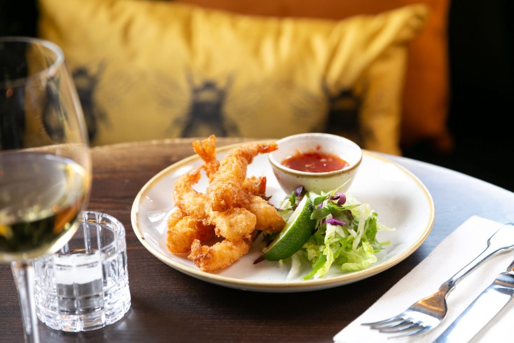 Crispy breaded prawns served with salad, lime and sweet chilli dipping sauce