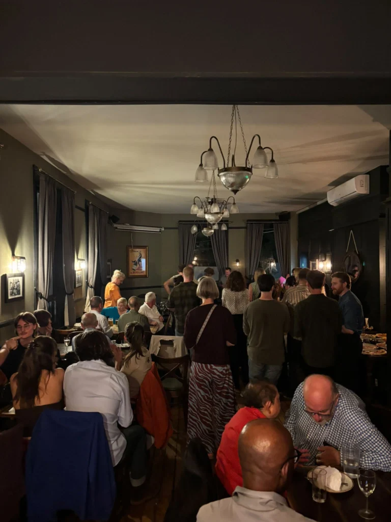 Busy private room at The Cambria filled with guests at an evening event